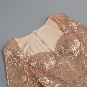 Close-up of rose gold sequin party dress featuring a sweetheart neckline and fine stitching