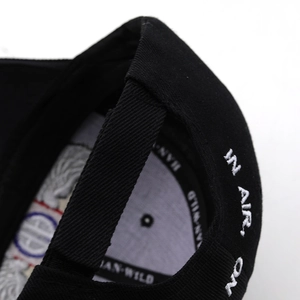 Detail of cotton baseball cap featuring 82nd Airborne embroidery and adjustable strap