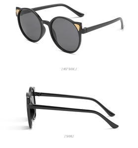 Detail view showing 45-degree and side angles of black cat-ear sunglasses with gold accents