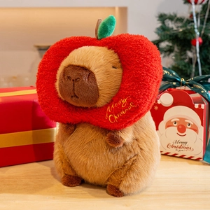 Capybara plush toy with red apple Christmas hat and scarf for festive decoration and gift