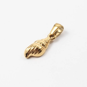 Macro shot of a polished golden seashell pendant made of stainless steel on white back