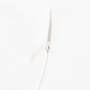 Close-up of the white invisible zipper on a backless sleeveless slim white bubble dress