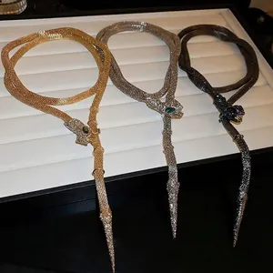 Exaggerated rhinestone snake necklace set in gold, silver, and black mesh weave