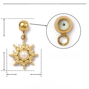 Detail showing the internal rubber stopper of the golden sunburst charm with pearl