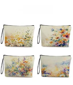 Detail showing four floral canvas makeup bags with daisy and sunflower prints