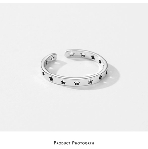 Detailed close-up of S925 sterling silver open ring with hollow star pattern design