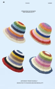 Detail showing four colorful handmade woven straw bucket hats with striped patterns