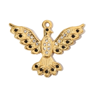 Detail of gold dove pendant with black and clear rhinestones on white background
