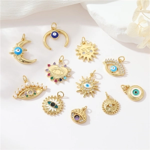 Gold celestial pendants with sun moon and evil eye motifs set with colorful zircon