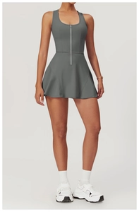 Front view of dark grey athletic dress with metal zipper and A-line skirt on model