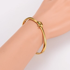 Minimalist 18K gold plated stainless steel snake head open bangle with green gemstone eyes
