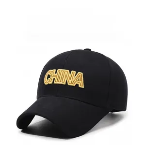 Close-up of yellow CHINA 3D embroidery on classic black cotton baseball cap