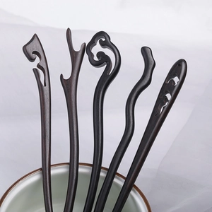 Handcrafted ebony hair sticks with traditional Chinese hollow carvings in dark brown wood