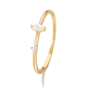 Detailed close-up of golden minimalist ring featuring marquise and round cut crystals