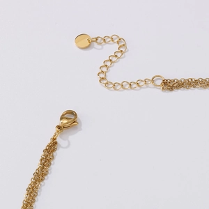 Close-up of gold butterfly necklace lobster clasp and adjustable extension chain link