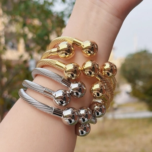 French vintage style twisted cable open bangle with gold and silver spheres