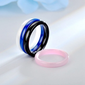 Detail of 3mm minimalist ceramic rings with smooth glossy finish in multiple colors