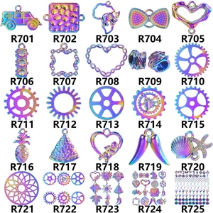 Iridescent crystal angel wing and assorted alloy pendants in a grid catalog display