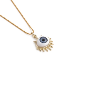 Detailed close-up of a gold box chain necklace with a blue enamel evil eye pendant