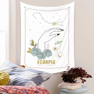 Detail of Scorpio zodiac tapestry with celestial symbols and floral line art on wall