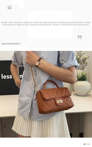 Detailed view of brown quilted PU leather handbag with gold chain strap and metal lock