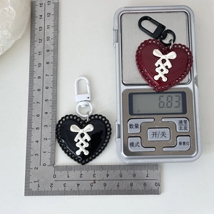Y2K heart keychain with ribbon bow in black and burgundy, measuring 4cm x 4cm