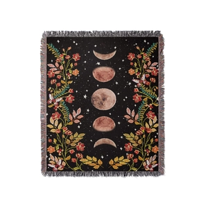 Bohemian moon phase woven camping blanket with floral patterns and fringed edges