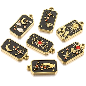 Detailed set of black enamel tarot pendants featuring celestial sun moon and star motifs