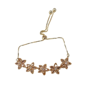 Adjustable gold flower bracelet with five champagne zircon star stones on white background