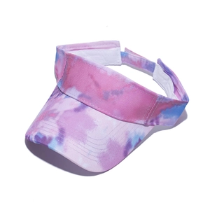 Detailed view of the colorful tie-dye patterns and stitching on the sun visor brim