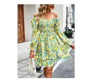 Detail of yellow floral off-shoulder mini dress with smocked waist and tiered ruffles