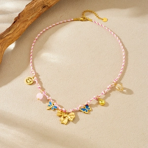 Bohemian woven cord necklace with gold insect pendants and colorful enamel charms