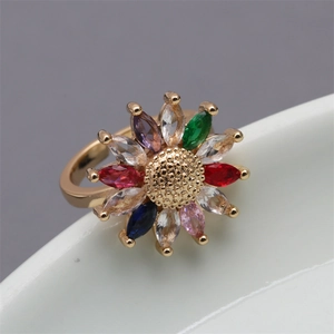 Adjustable gold sunflower ring featuring colorful marquise-cut zircon stones on a white dish