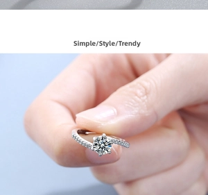 Macro shot of silver ring with six-prong set round cubic zirconia and pavé band side