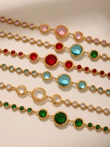 Close-up of Czech glass bracelets in various colors with 18K gold plated settings