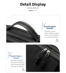 Detail view of reinforced leather handle and durable dual metal zippers on black laptop bag