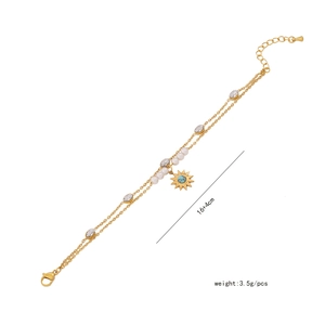Close-up of pearl bracelet with gold chain, sunburst charm and 16+4cm size detail