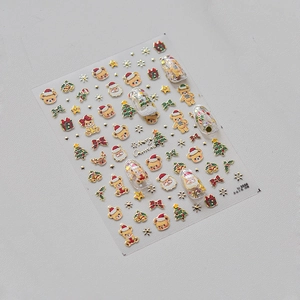 Détails macro des autocollants 3D de Noël pour ongles avec ours dorés en relief