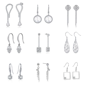 Macro detail of nine S925 sterling silver drop earrings with sparkling zircon stones