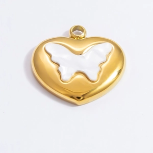 Detail of a gold-plated stainless steel heart pendant with hollow butterfly design