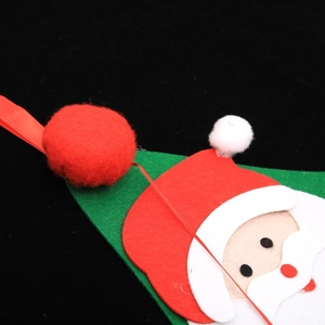 Creative Christmas felt countdown calendar with red Santa face and pom-poms decor