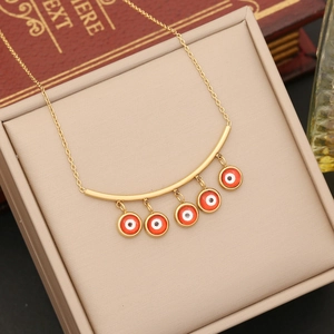 Gold stainless steel necklace with evil eye pendants on a long tassel bar link