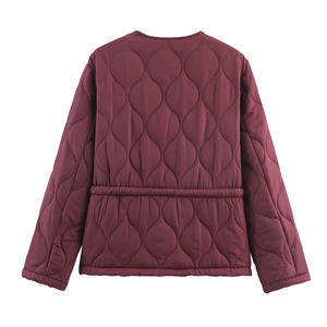 Back view of burgundy quilted jacket showing wave stitching and elastic waist detail