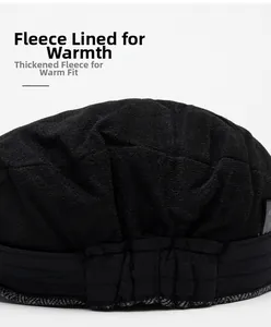 Detail view of the warm fleece lining inside the black wool newsboy cap for winter