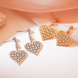 Fashionable hollow heart pendant earrings in gold and silver finish with sparkling rhinestones