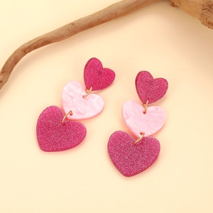 Barbie pink acrylic heart drop earrings with glitter and marble textures for women