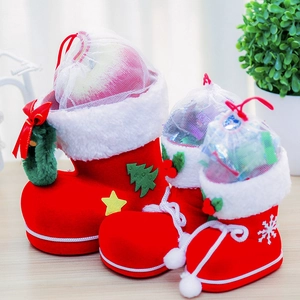 Three sizes of red flocked Christmas candy boots with white faux fur trim and drawstrings