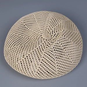 Detailed top view of beige crochet knit beret showcasing hollow breathable mesh pattern