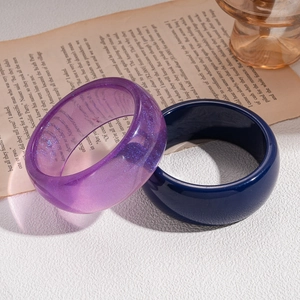 Vintage chunky resin bangles in translucent glitter purple and solid navy blue