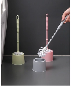 Detailed set of three long-handled toilet brushes with bases in green, pink and grey colors